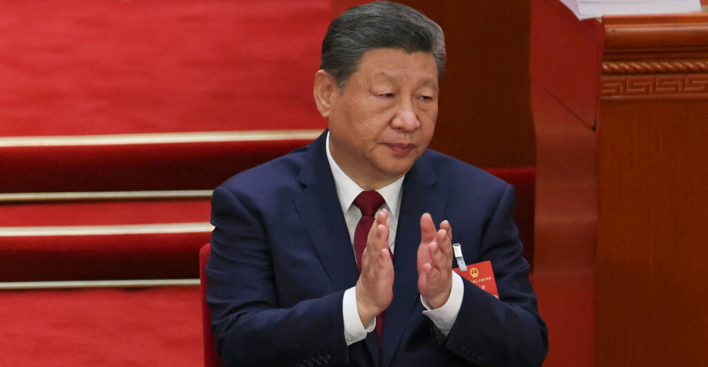 Xi Jinping applauding.