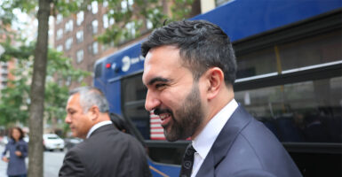 NEW YORK, NEW YORK - OCTOBER 08: New York Mayoral candidate Zohran Mamdani steps off the M57 bus on his way to a press conference on October 08, 2025 in New York City. Mamdani was joined by Rep. Jerry Nadler (D-NY), Comptroller Brad Lander, Transit Workers United President John Samuelson and Mobilization Coordinator, Communications Workers of America Local 1180 Helen Jarrett after riding the M57, the slowest bus in NYC, to speak about the need for his campaign promise of fast and free bus service. Earlier this week, Mamdani launched a “Costs Saved” calculator that helps to show much money people will save due to his three core policy proposals of universal childcare, a rent freeze for rent-stabilized apartments, and free buses. (Photo by Michael M. Santiago/Getty Images)