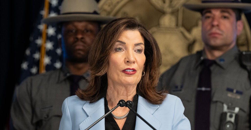 NEW YORK, UNITED STATES - 2026/04/15: Governor Kathy Hochul speaks at Governor office in New York as she announced proposal for state budget to include safety barriers around places where people congregate to pray as well as pied-à-terre tax on luxury secondary homes in New York City valued at $5 million or more. (Photo by Lev Radin/Pacific Press/LightRocket via Getty Images)