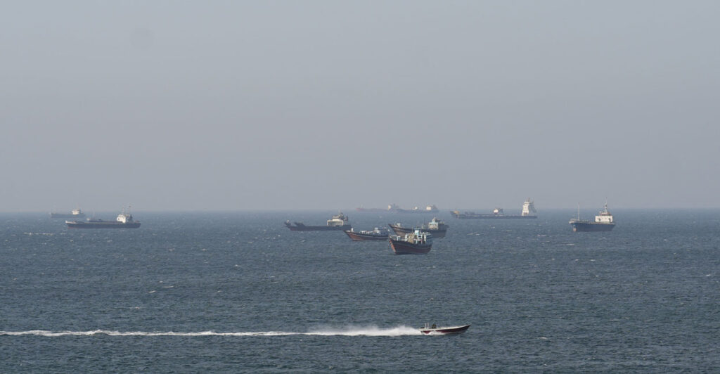 Ships and tankers in the Strait of Hormuz off the coast of Musandam, Oman.