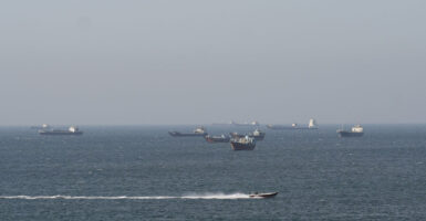 Ships and tankers in the Strait of Hormuz off the coast of Musandam, Oman.