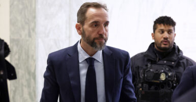 WASHINGTON, DC - DECEMBER 17: Former Special Counsel Jack Smith (C) arrives to testify during a closed-door deposition before the House Judiciary Committee in the Rayburn House Office Building on Capitol Hill on December 17, 2025 in Washington, DC. Smith was appointed independent special counsel by Attorney General Merrick Garland in 2022 to oversee two criminal investigations into former President Donald Trump's role in the January 6, 2021 attack on the U.S. Capitol and mishandling of classified documents. Both cases were eventually dismissed and Trump went on to win his second presidential election in 2024. (Photo by Alex Wong/Getty Images)