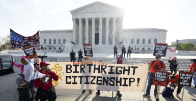 WASHINGTON, DC - APRIL 01: People demonstrate outside the U.S. Supreme Court ahead of U.S. President Donald Trump's expected arrival on April 01, 2026 in Washington, DC. The Supreme Court is hearing oral arguments in Trump v. Barbara to determine if President Trump's executive order ending birthright citizenship is constitutional. According to historians and the Court, this is the first time a sitting president has attended oral arguments at the nation's highest court. (Photo by Al Drago/Getty Images)
