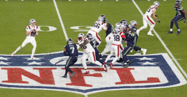 SANTA CLARA, CALIFORNIA - FEBRUARY 08: Drake Maye #10 of the New England Patriots drops back to pass against the Seattle Seahawks during the fourth quarter in Super Bowl LX at Levi's Stadium on February 08, 2026 in Santa Clara, California. (Photo by Thearon W. Henderson/Getty Images)