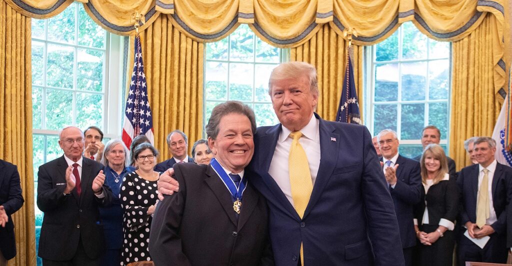 Donald Trump and Arthur Laffer smiling