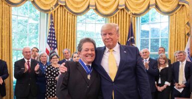 Donald Trump and Arthur Laffer smiling
