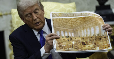President Donald Trump shows off renderings of the new White House ballroom.