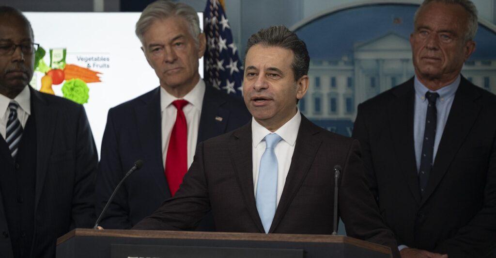 Martin Makary speaking at a podium.