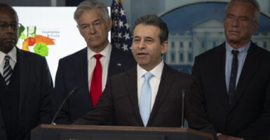 Martin Makary speaking at a podium.