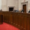 Justices sit and listen during a ceremony at the Virginia Supreme Court