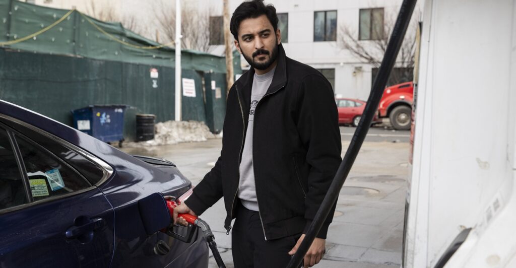 A man pumps gasoline.