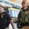 ICE agents in an airport