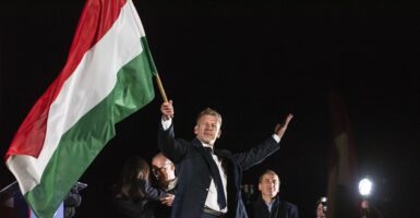 Peter Magyar waving the Hungarian flag