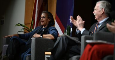 John Bolton and Susan Rice seated