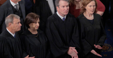 WASHINGTON, DC - FEBRUARY 24: U.S. Supreme Court Chief Justice John Roberts and Associate Justices Elena Kagan, Brett Kavanaugh and Amy Coney Barrett applaud at the conclusion of President Donald Trump's State of the Union address during a joint session of Congress at the Capitol on February 24, 2026, in Washington, DC. Trump delivered his address days after the Supreme Court struck down the administration's tariff strategy and amid a U.S. military buildup in the Persian Gulf threatening Iran. (Photo by Chip Somodevilla/Getty Images)