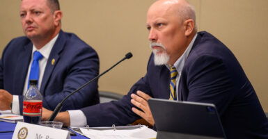 Chip Roy waits to speak at a committee roundtable.