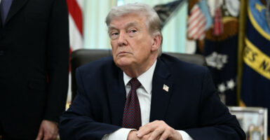 President Donald Trump speaks to reporters in the oval office